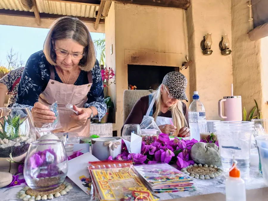 A guest preparing her creation at a workshop